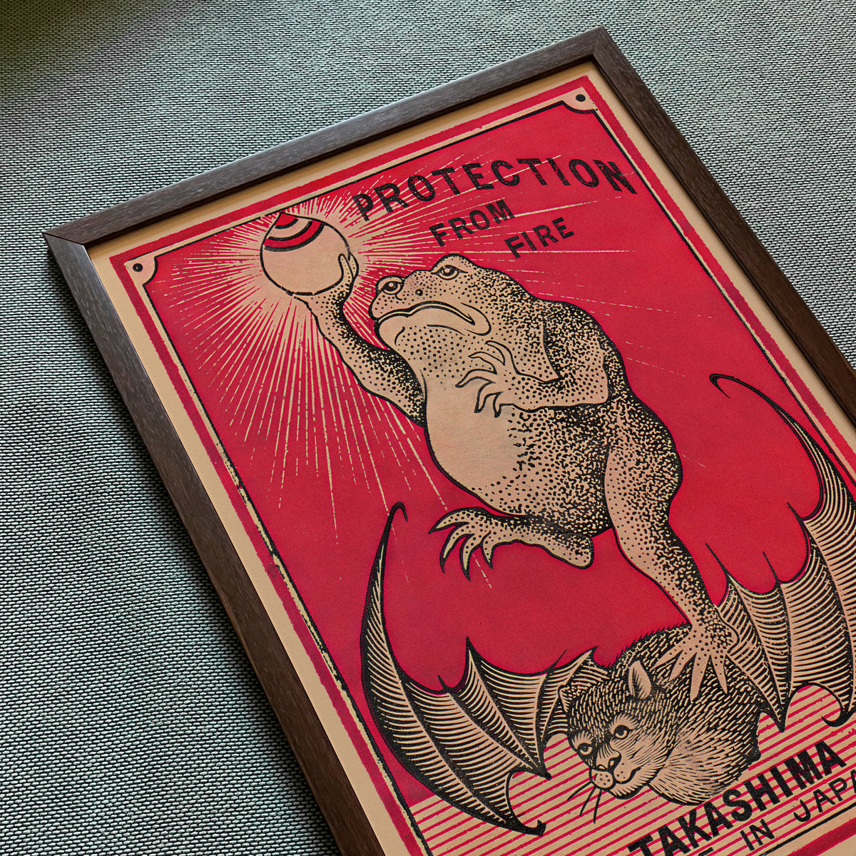 Close-up of Frog Protection from Fire art print featuring a frog and vintage fire-protection graphics.