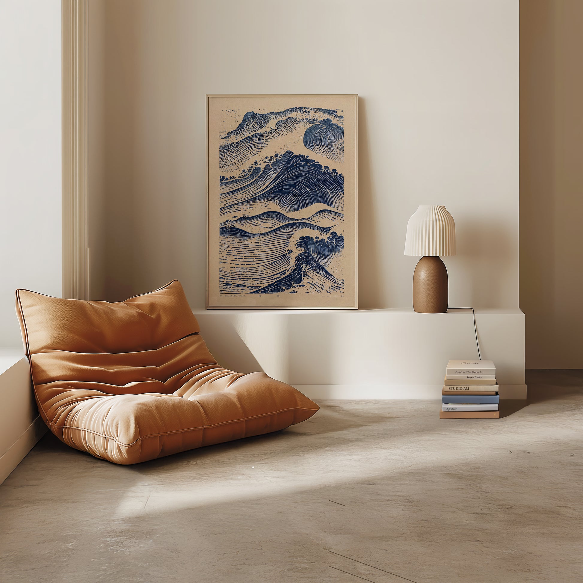 Modern interior with a brown leather chair, framed artwork, and lamp on a white console table.